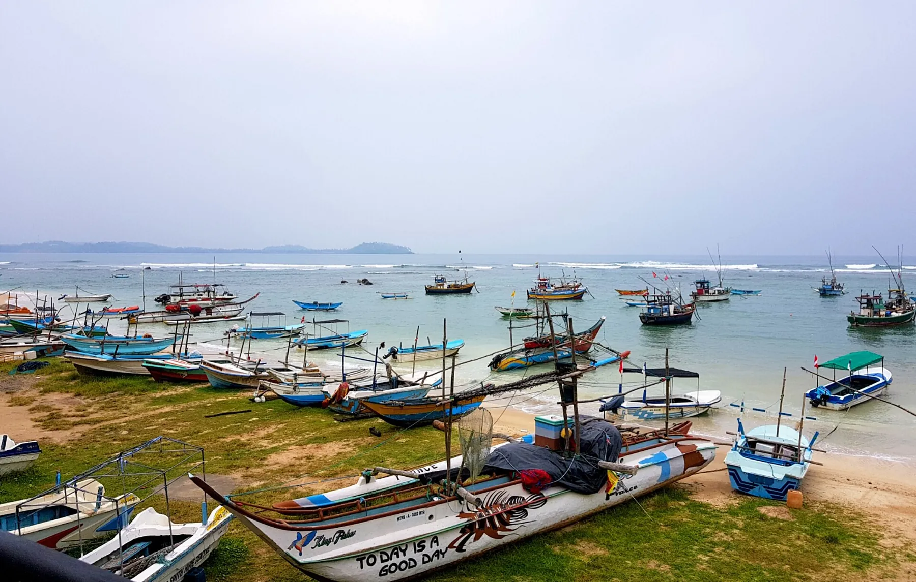Colourful fishing boats moored in Weligama bay.