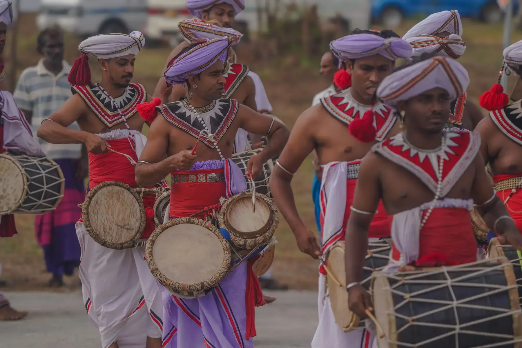 Sri Lankan drummers in traditional dress in a parade.