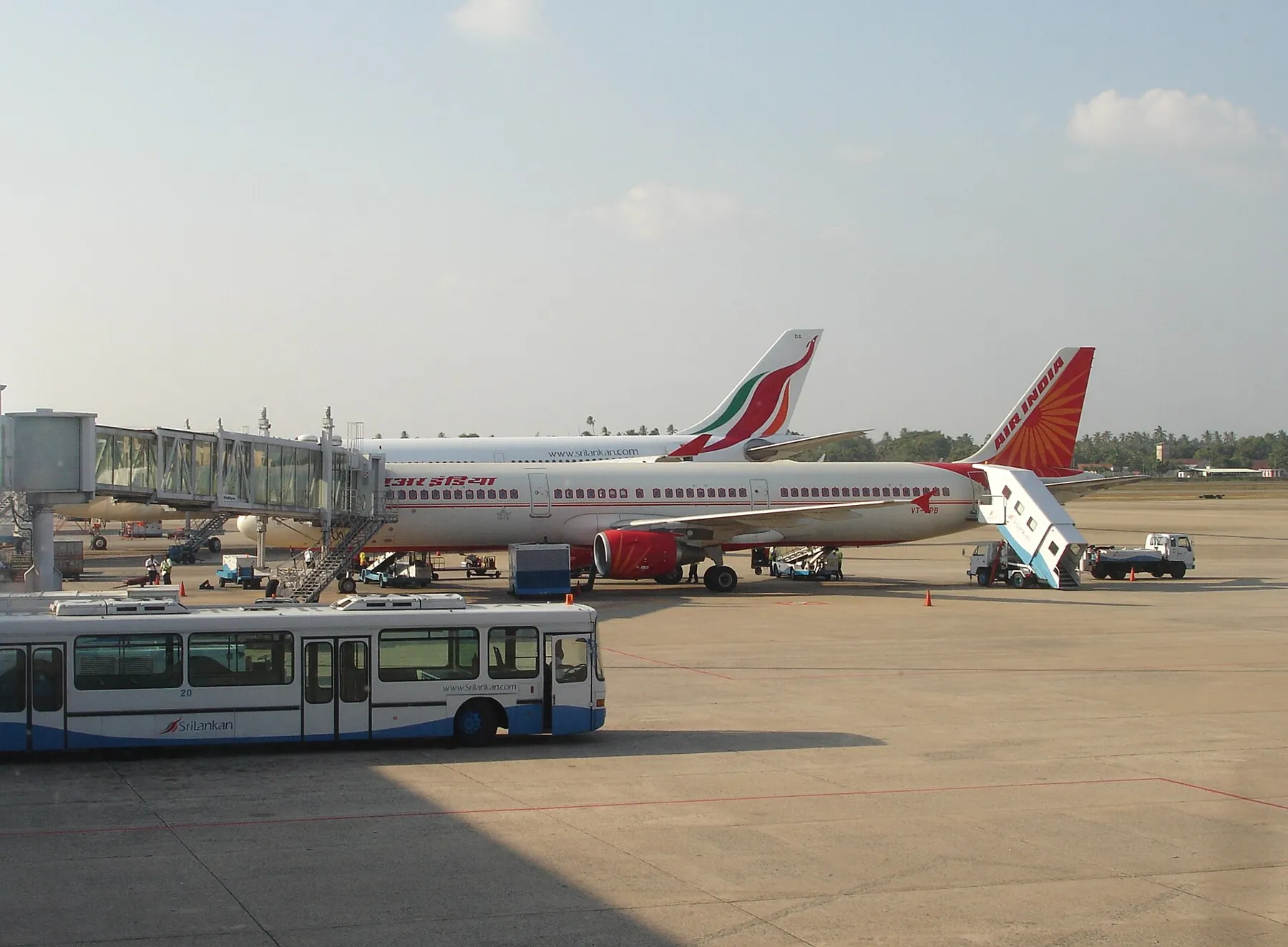 Air India and SriLankan Airlines aircraft parked at the terminal gates of Bandaranaike International Airport, Colombo.